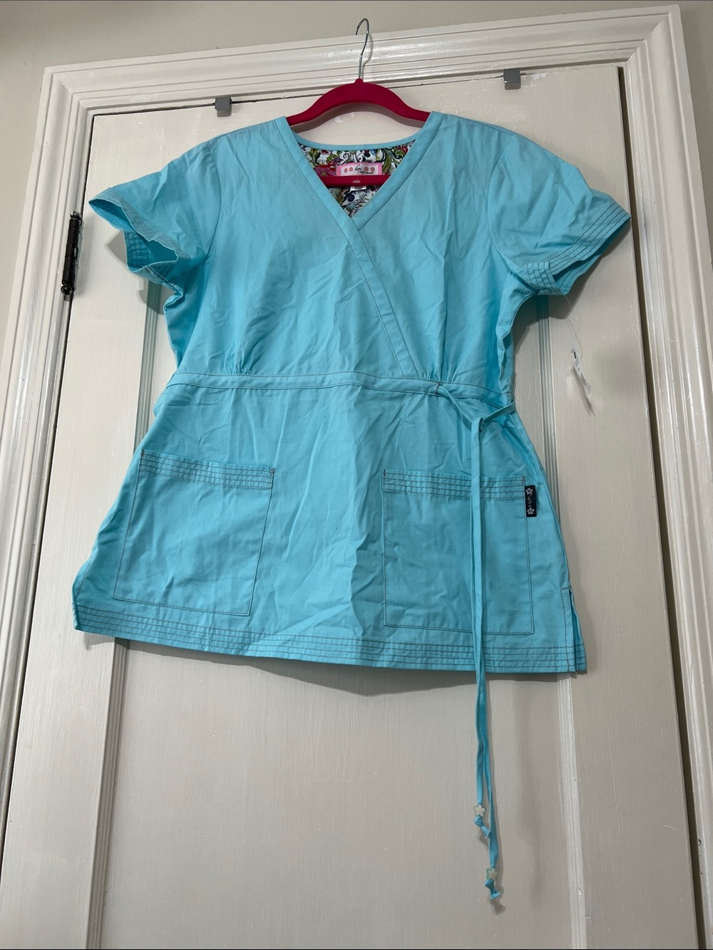 koi Katelyn Aqua Medical Scrub Top with Floral Tag